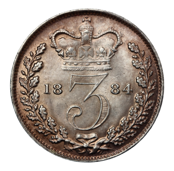High grade threepence dated 1884