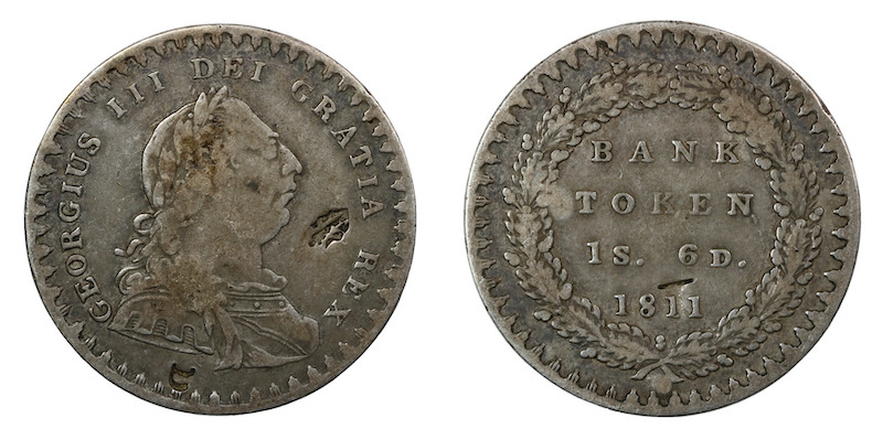 Eighteen pence 1811 english bank token with countermarks