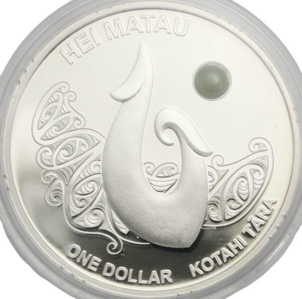 Maori arts silver fishing hook coin with green stone